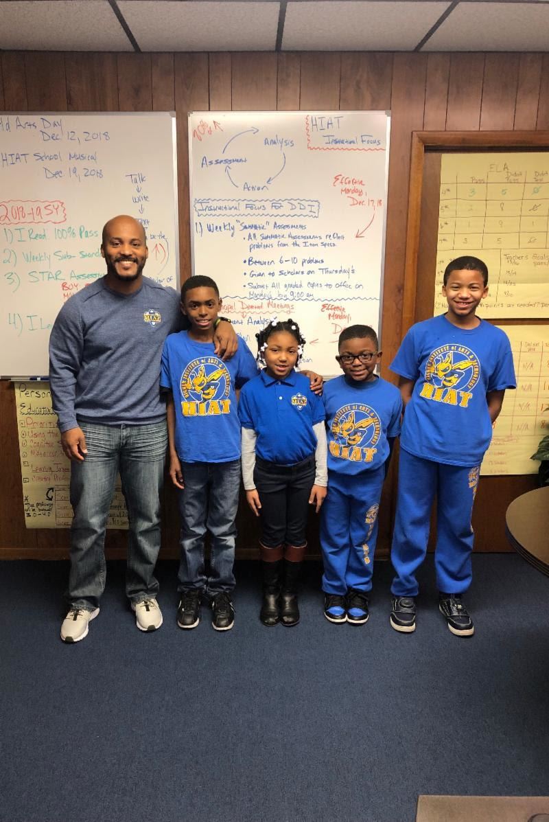 Mr. Fitch smiling with his student scholars. Mr. Fitch smiling with his student scholars.