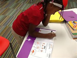 PLA scholar working on a class assinment 