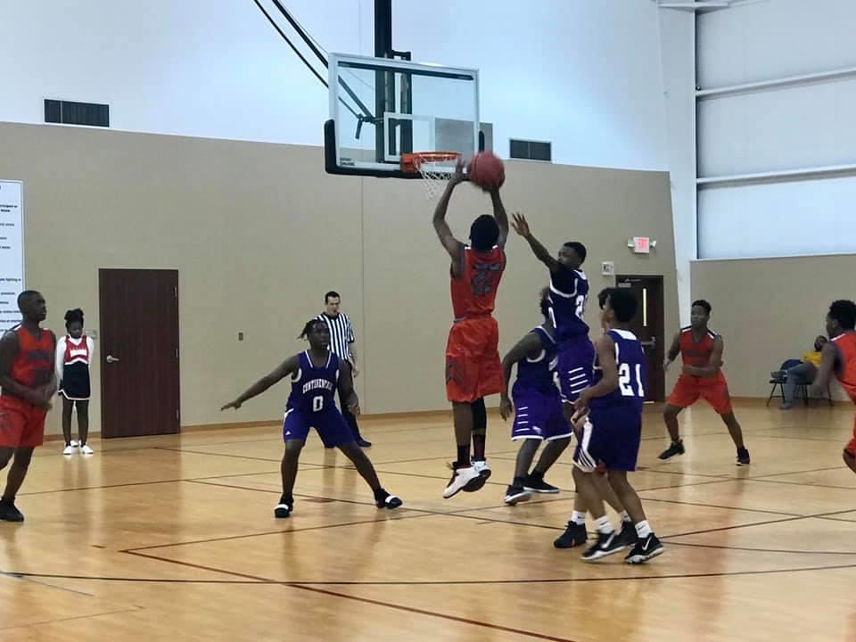 Phalen scholar scoring a point during the basketball game.  