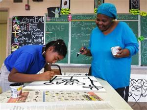 HIAT student and her grandparent painting sky art 